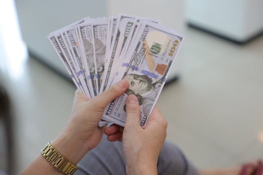 Money dollar bill with hand photo