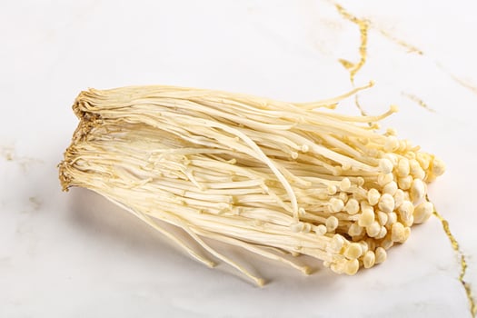 Tasty raw enoki mushroom heap photo