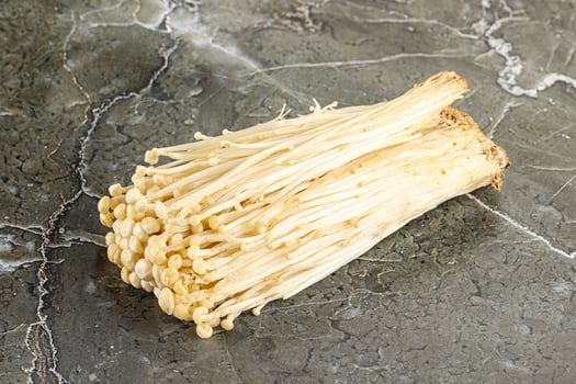 Tasty raw enoki mushroom heap photo