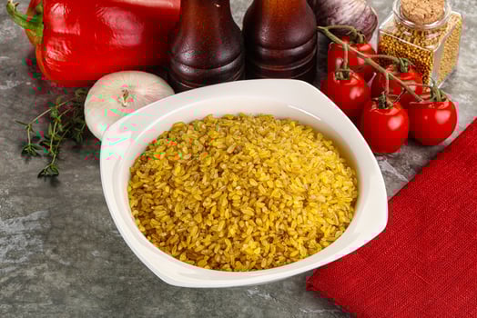 Dry wheat bulgur cereal heap photo