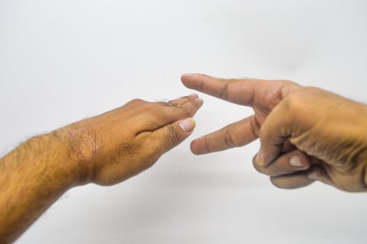 hands are playing rock paper scissors photo