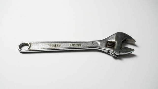Adjustable wrench on a white background. photo