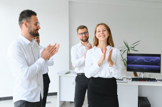 Business people stand on the background of the office corridor photo