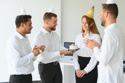 business team celebrating a birthday in the office. photo
