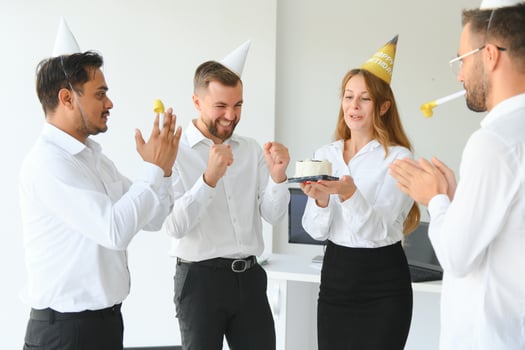 business team celebrating a birthday in the office. photo