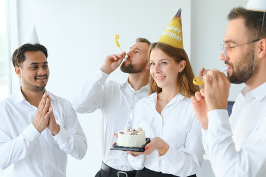 corporate party and people concept - happy team with cake celebrating colleague birthday at office photo