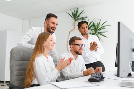 Team at work. Group of young business people in smart casual wear working together in creative office photo