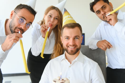 Business team celebrating a birthday of collegue in the modern office. photo