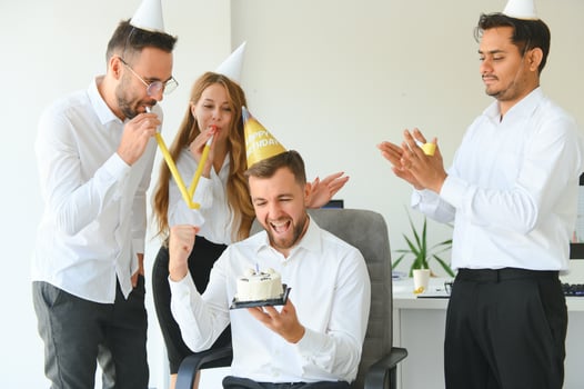 Business team celebrating a birthday of collegue in the modern office. photo