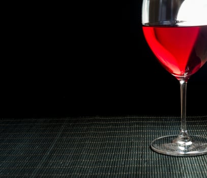 Wineglass with red wine photo
