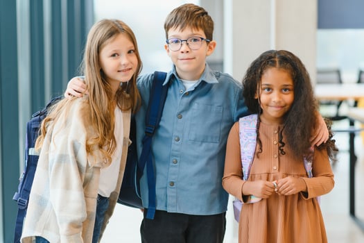 Portrait of kids standing in elementary school hallway photo