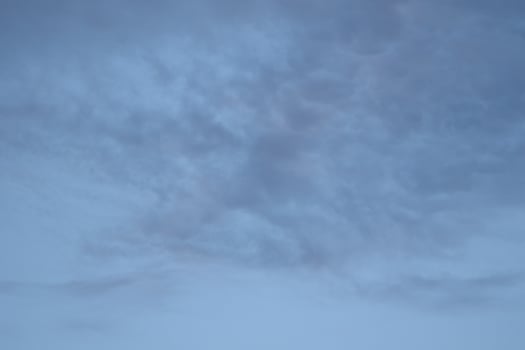 Cloudscape scenery, overcast weather above dark blue sky. Storm clouds floating in a rainy dull day with natural light. White and grey scenic environment background. Nature view. photo