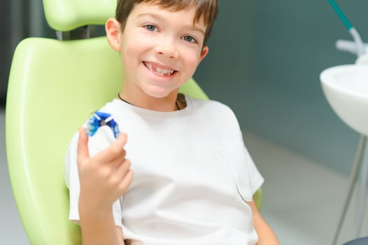 Boy wear dental orthodontic plate for teeth. Orthodontics photo