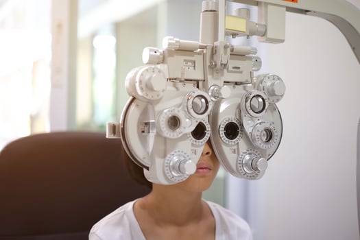Child eye exam, kid eye test, Phoropter eye test photo