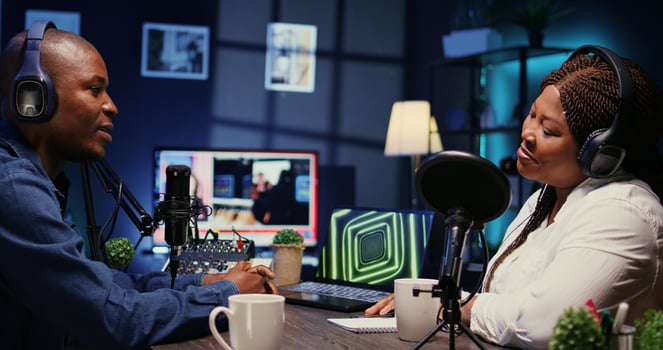 Online show host listening to guest opinion on current events during live broadcast for social media platforms. African american influencer using professional gear to record podcast, zoom in shot photo