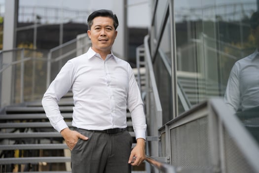Confident businessman descending outdoor stairs photo