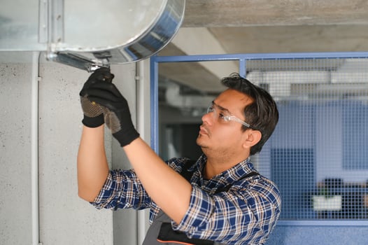 Ventilation cleaning. Specialist at work. Repair ventilation system HVAC. Industrial background photo