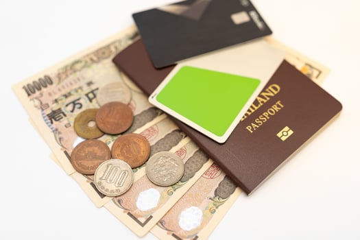 Thai Passport, Japanese money and IC card. vacation, planning budget. travel plan concept. photo
