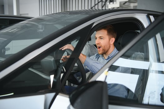 Man adult customer male buyer client chooses auto wants to buy new automobile photo