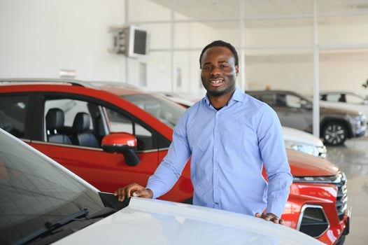 Happy Car Buyer, New Car Owner Concept. Portrait Of Excited Young African American Guy In Dealership Showroom photo