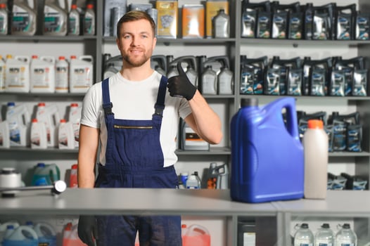 A salesman in an auto parts store. Retail trade of auto parts photo