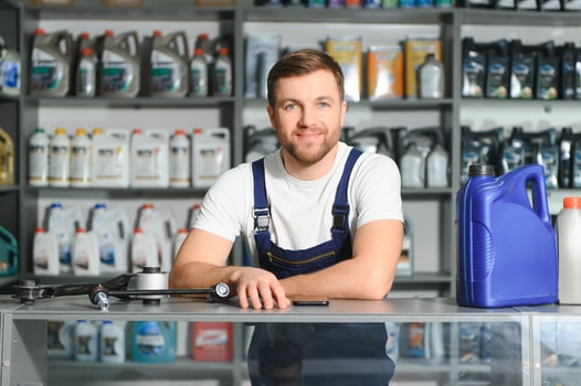 A salesman in an auto parts store. Retail trade of auto parts photo