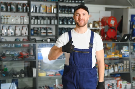 A salesman in an auto parts store. Retail trade of auto parts photo