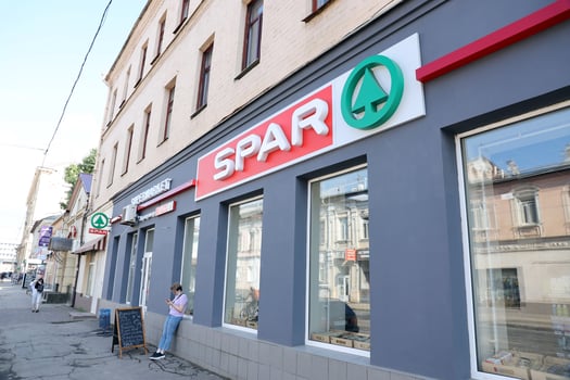 KHARKIV, UKRAINE - AUGUST 29, 2021 Spar logo on a wall. Spar is an international group of independently owned and operated retailers and wholesalers who work together photo