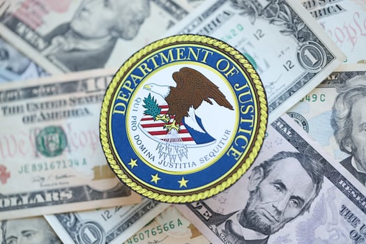 KYIV, UKRAINE - MARCH 9, 2024 US Department of Justice seal on many US dollar bills photo