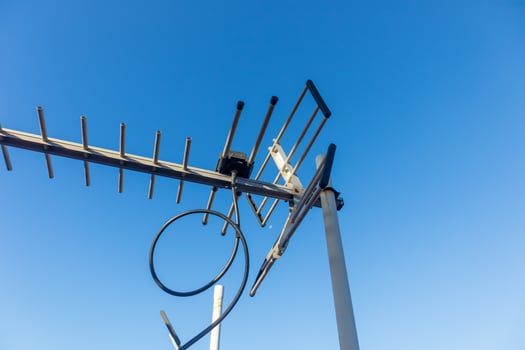 Aerial TV Antenna with clear blue sky photo