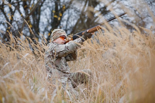 Hunting permit. Man brutal gamekeeper nature background. hunter spend leisure hunting. Hunter hold riffles. Focus and concentration of experienced hunter. Hunting and trapping seasons photo
