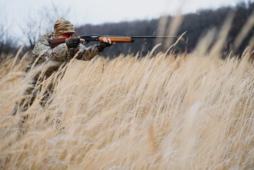 Hunting permit. Man brutal gamekeeper nature background. hunter spend leisure hunting. Hunter hold riffles. Focus and concentration of experienced hunter. Hunting and trapping seasons photo