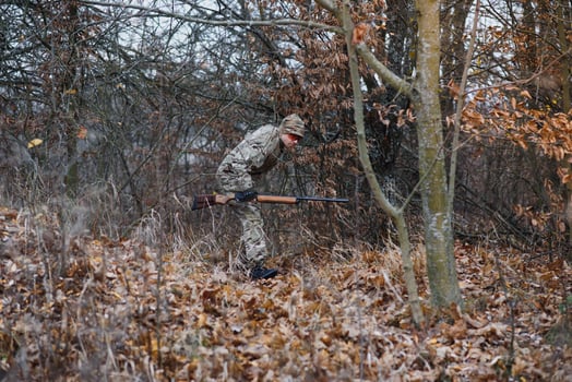 Hunting permit. Man brutal gamekeeper nature background. hunter spend leisure hunting. Hunter hold riffles. Focus and concentration of experienced hunter. Hunting and trapping seasons photo