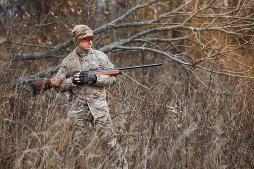 Hunting permit. Man brutal gamekeeper nature background. hunter spend leisure hunting. Hunter hold riffles. Focus and concentration of experienced hunter. Hunting and trapping seasons photo
