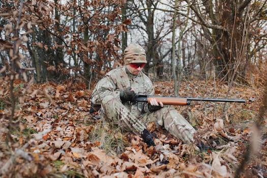 Hunting permit. Man brutal gamekeeper nature background. hunter spend leisure hunting. Hunter hold riffles. Focus and concentration of experienced hunter. Hunting and trapping seasons photo