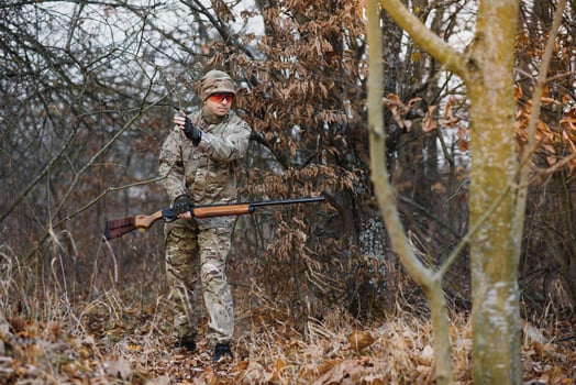 Hunting permit. Man brutal gamekeeper nature background. hunter spend leisure hunting. Hunter hold riffles. Focus and concentration of experienced hunter. Hunting and trapping seasons photo