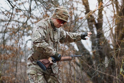 Hunting permit. Man brutal gamekeeper nature background. hunter spend leisure hunting. Hunter hold riffles. Focus and concentration of experienced hunter. Hunting and trapping seasons photo