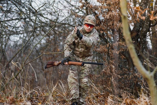 Hunting permit. Man brutal gamekeeper nature background. hunter spend leisure hunting. Hunter hold riffles. Focus and concentration of experienced hunter. Hunting and trapping seasons photo