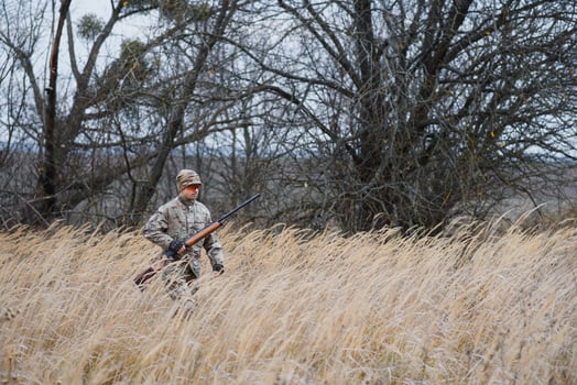 Hunting permit. Man brutal gamekeeper nature background. hunter spend leisure hunting. Hunter hold riffles. Focus and concentration of experienced hunter. Hunting and trapping seasons photo