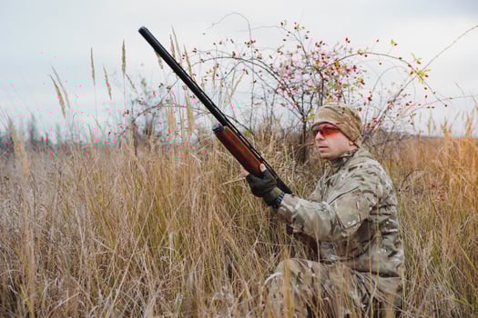 Hunting permit. Man brutal gamekeeper nature background. hunter spend leisure hunting. Hunter hold riffles. Focus and concentration of experienced hunter. Hunting and trapping seasons photo