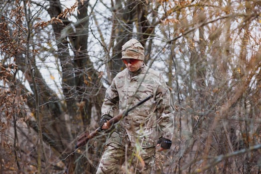 Hunting permit. Man brutal gamekeeper nature background. hunter spend leisure hunting. Hunter hold riffles. Focus and concentration of experienced hunter. Hunting and trapping seasons photo