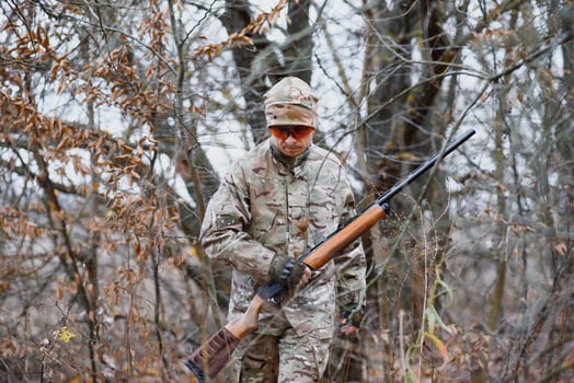 Hunting permit. Man brutal gamekeeper nature background. hunter spend leisure hunting. Hunter hold riffles. Focus and concentration of experienced hunter. Hunting and trapping seasons photo