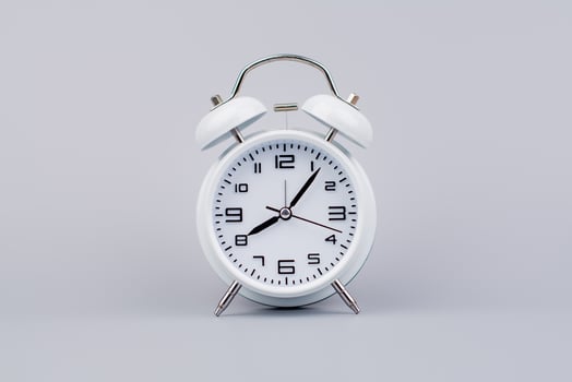 Modern alarm clock ticking, standing still time, time concept, time photography in studio. photo