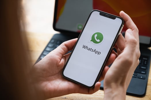CHIANG MAI, THAILAND - Mar 10, 2021 . Woman using iPhone and open Whatsapp social Internet service photo
