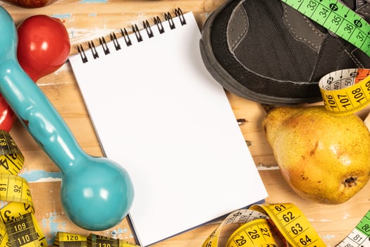 fruit for weight loss with measuring tape and equipment for exercise and diet, weight loss photo