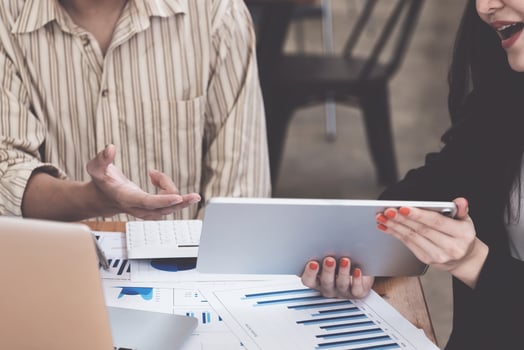 Fund managers collaborate on research and analysis. Stock market investment using digital tablet and corporate paperwork exclusive meeting. photo