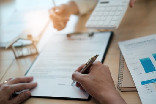 After a discussion in a exclusive room at the corporate , a businessman and his partner sign a contract investment professional paper agreement. photo
