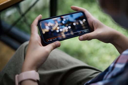 While quarantine a women watching live streaming by application on smartphone. photo