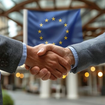 AI generated Two Men Shaking Hands in Front of European Flag photo