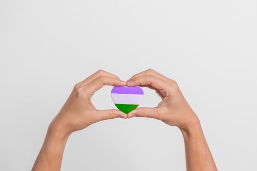 Queer Pride Day and LGBT pride month concept. purple, white and green heart shape for Lesbian, Gay, Bisexual, Transgender, genderqueer and Pansexual community photo